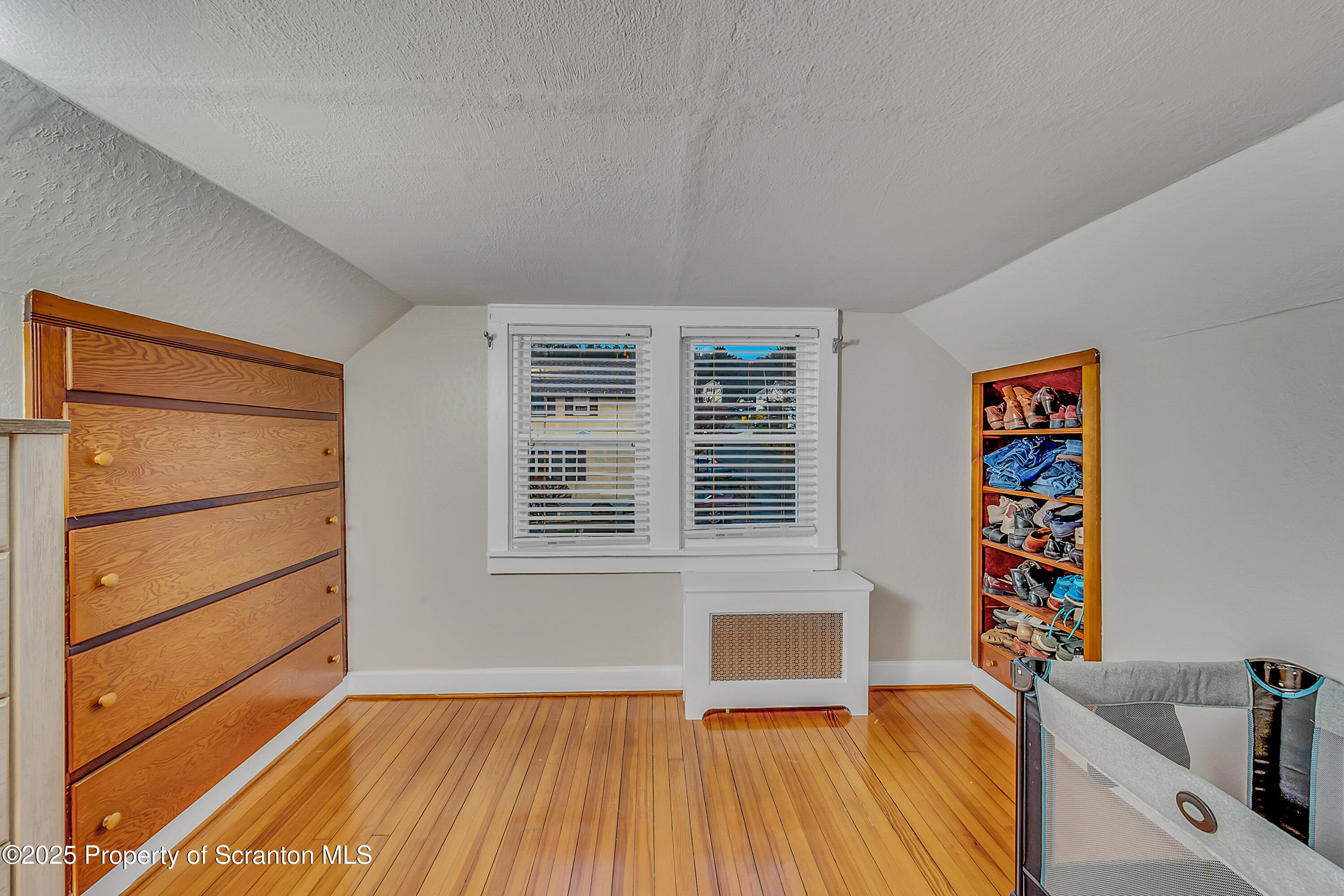 191 Ash Street Archbald, PA 18403 - Photo 17 of 28 a view of a room with wooden floor and window