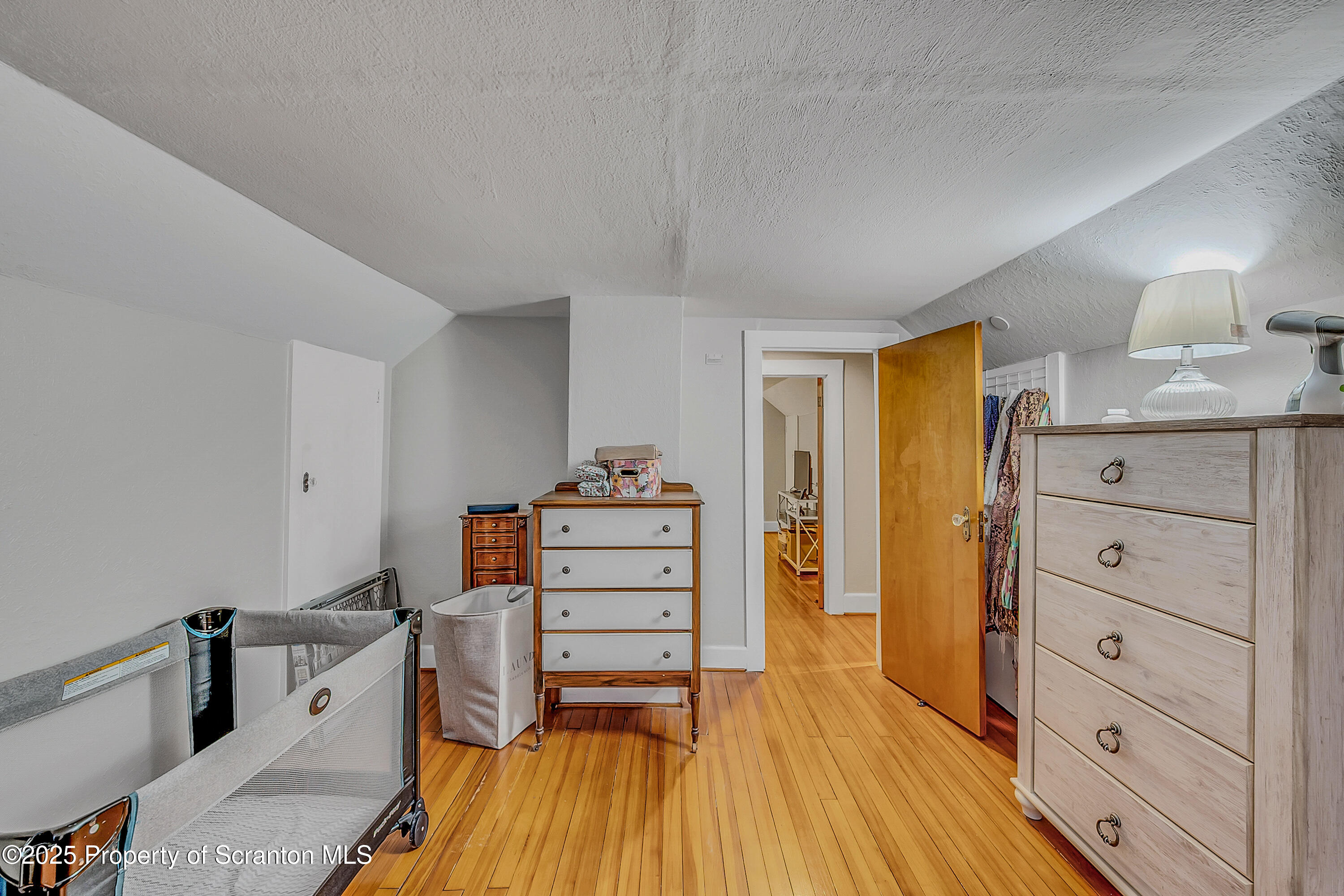 191 Ash Street Archbald, PA 18403 - Photo 18 of 28 a room with a bed and furniture