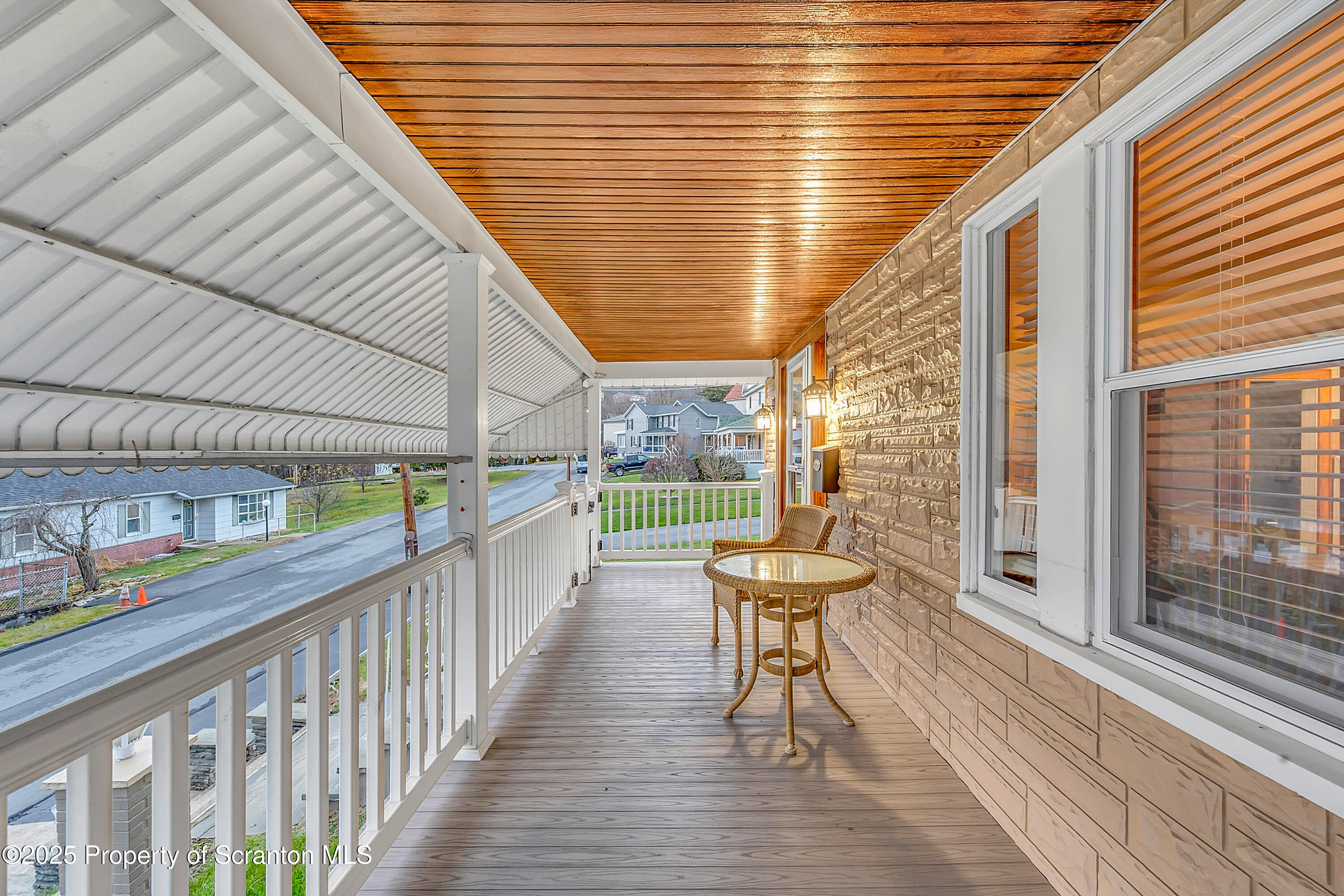 191 Ash Street Archbald, PA 18403 - Photo 2 of 28 a balcony with chairs and wooden floor