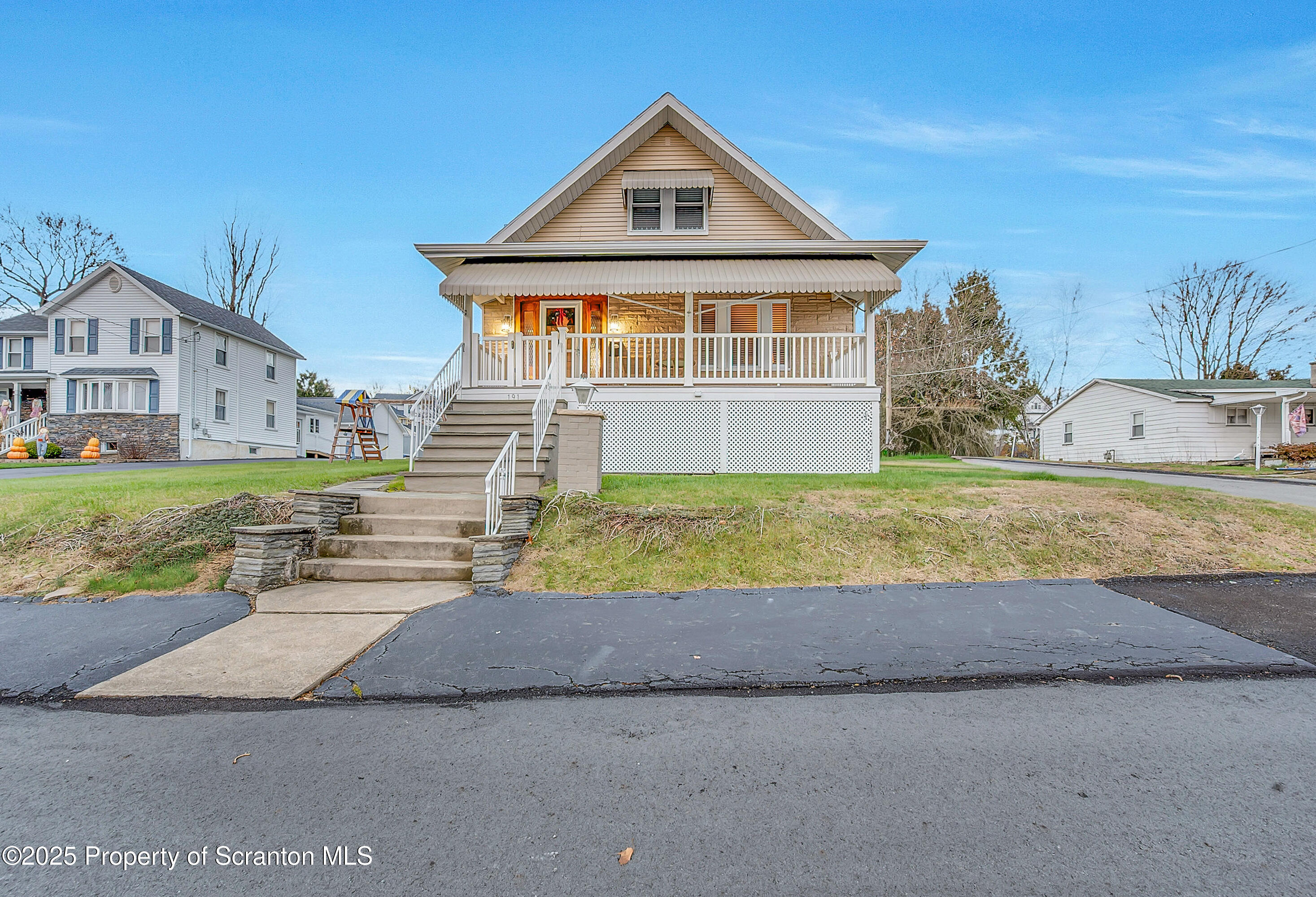 191 Ash Street Archbald, PA 18403 - Photo 23 of 28 a front view of a house with a yard and garage