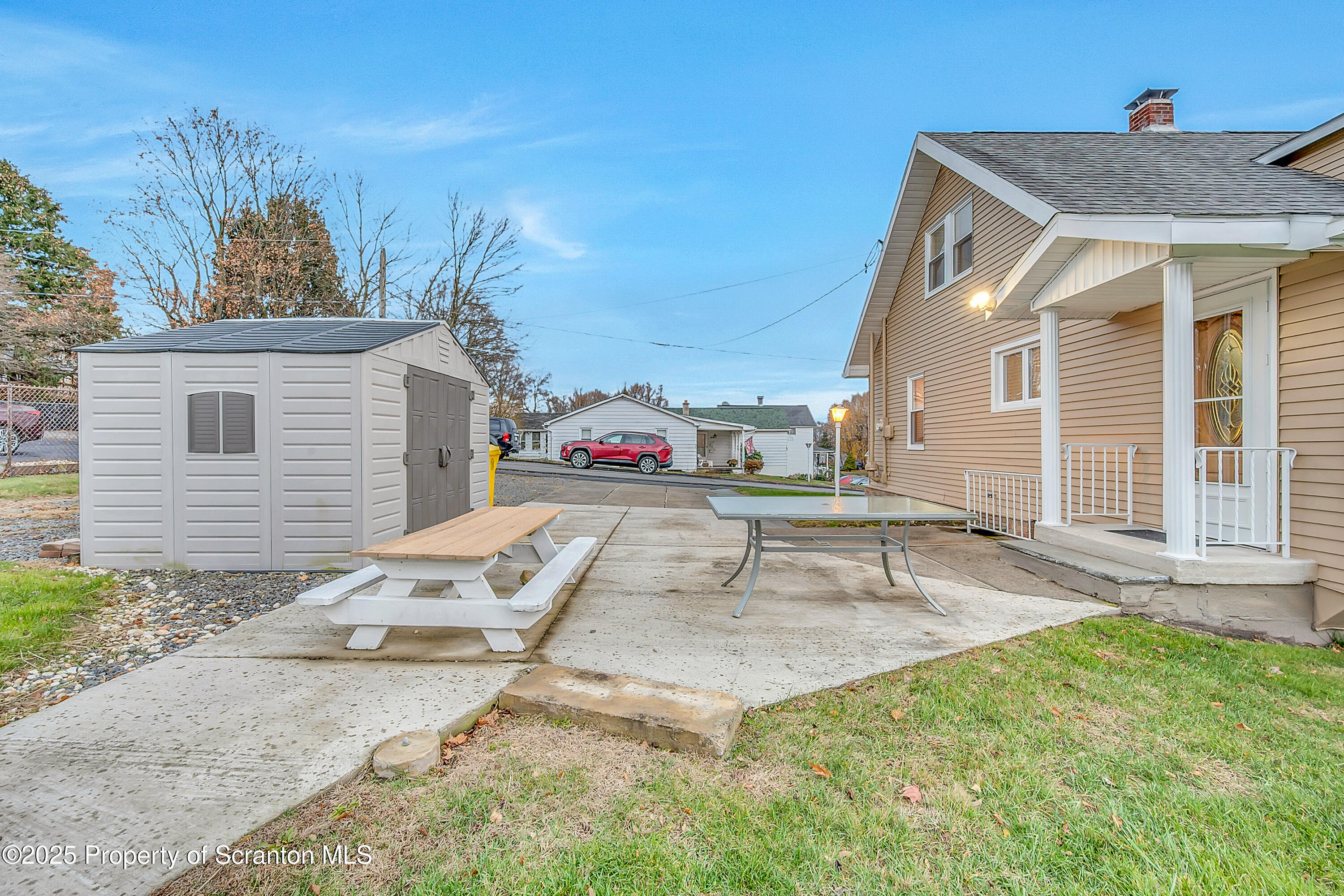 191 Ash Street Archbald, PA 18403 - Photo 3 of 28 a backyard of a house with table and chairs