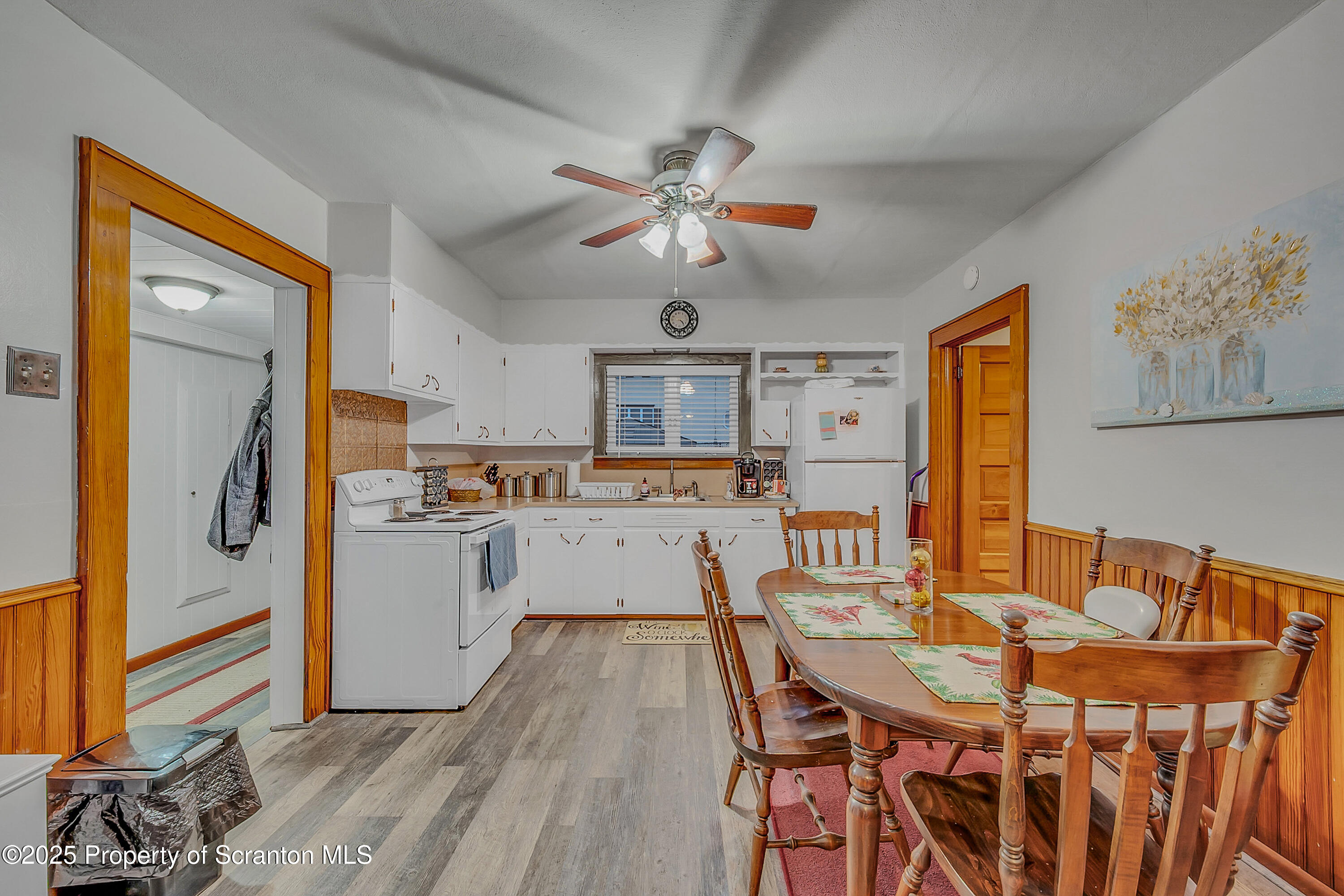 191 Ash Street Archbald, PA 18403 - Photo 9 of 28 a kitchen with stainless steel appliances kitchen island granite countertop a table chairs and a refrigerator