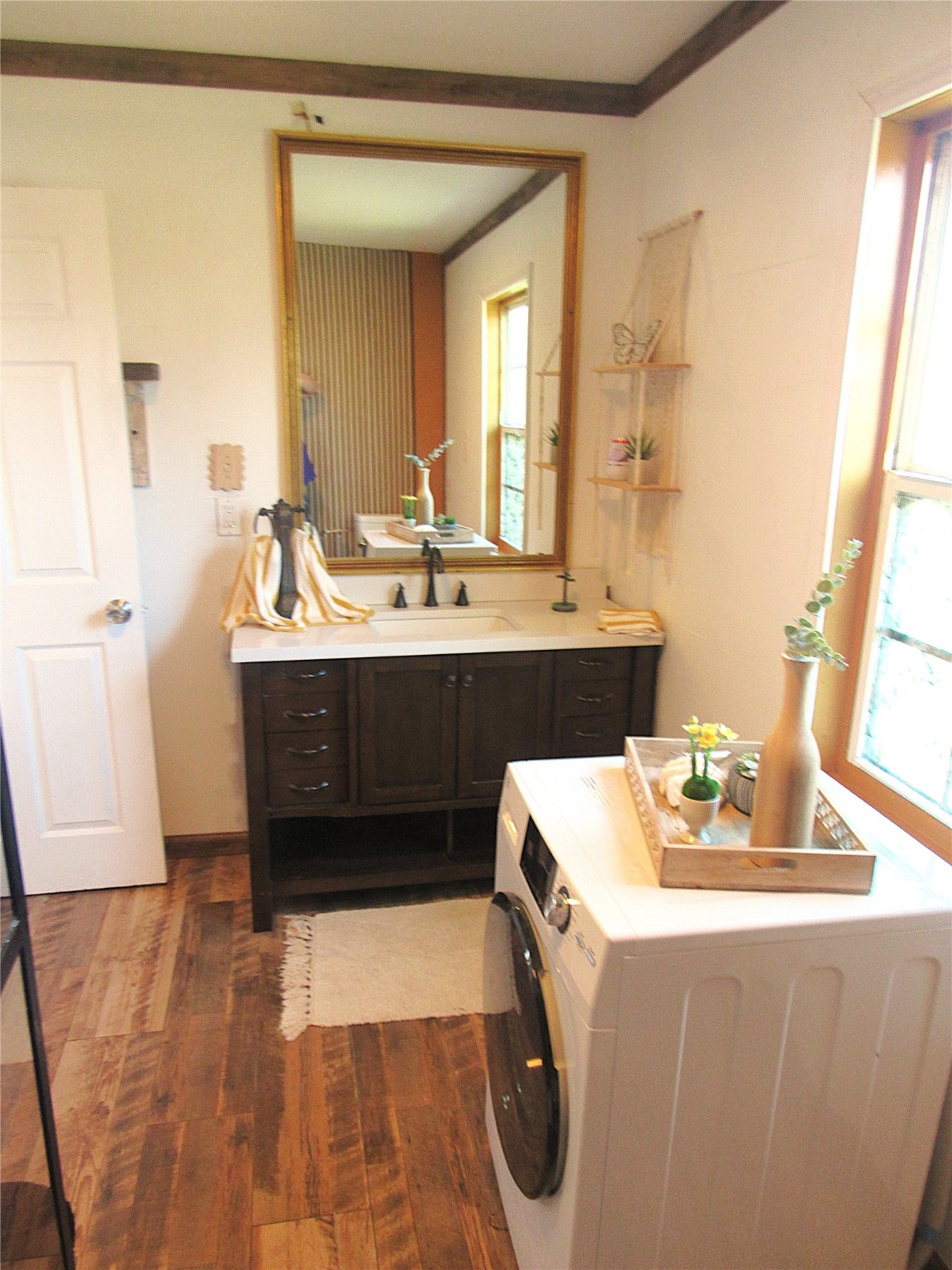 2503 River Crest Houston, TX 77338 - Photo 22 of 35 a room with a sink a washer and dryer with wooden floor