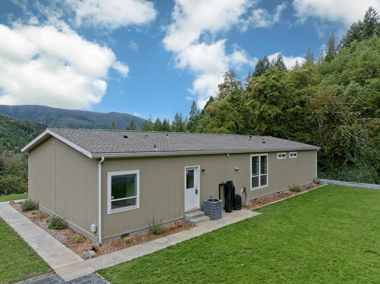 5572 Jumpoff Joe Creek Road Grants Pass, OR 97526 - Photo 32 of 38 a view of house with backyard