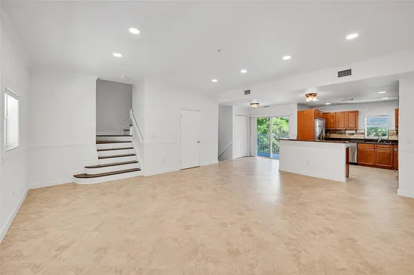 a view of a kitchen with a sink and an oven