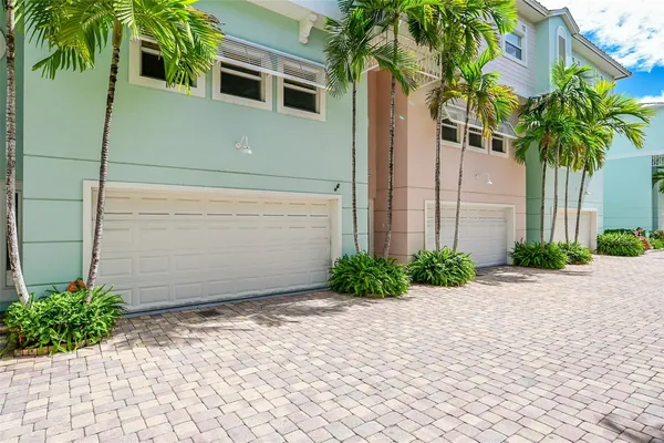 a couple of potted plants in front of door