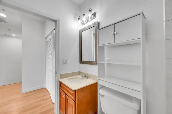 a utility room with cabinets washer and dryer