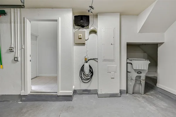 an aerial view of a house with a yard and lake view in back