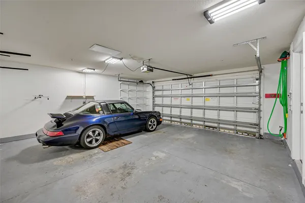 an aerial view of residential houses with outdoor space and street view