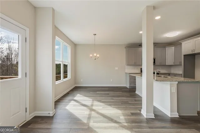 a living room with a fireplace and a large window