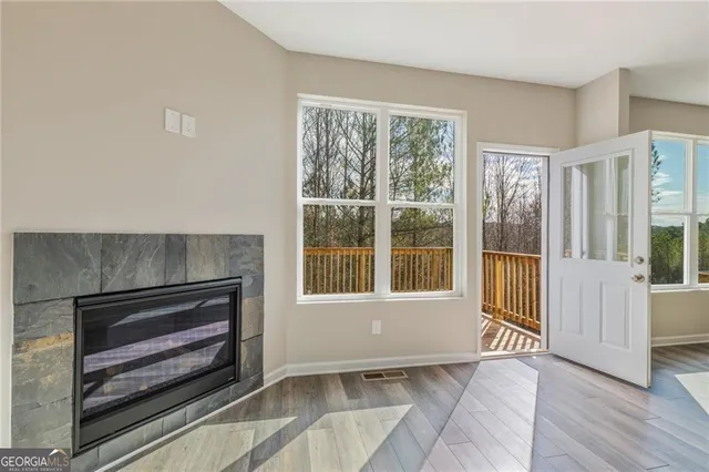 a kitchen with granite countertop a refrigerator stove and sink