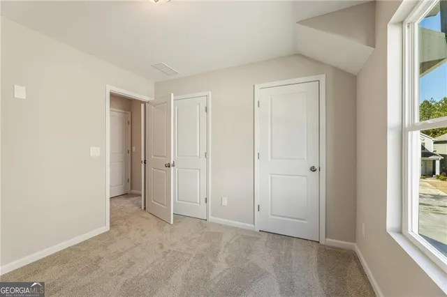 a view of a house with wooden deck
