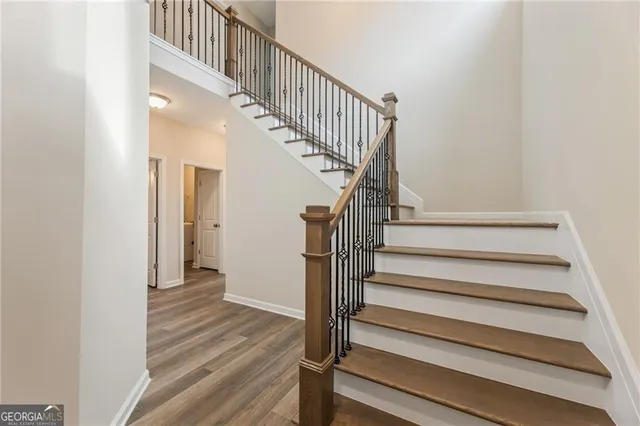 a view of a hallway with staircase
