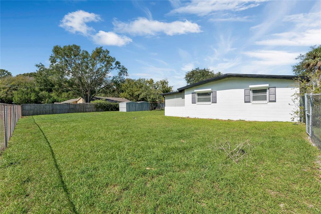 448 Ridge Drive Sanford, FL 32773 - Photo 17 of 20 a front view of house with yard and green space