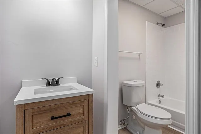 a bathroom with a sink toilet and vanity
