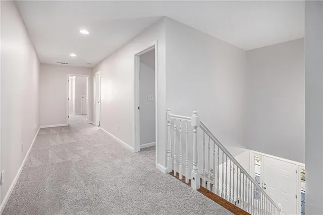 a view of a hallway with staircase