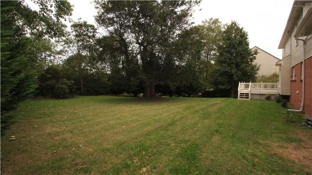 629 Rutherford Lane Franklin, TN 37064 - Photo 3 of 20 Large, mature trees surround this very private and lush back yard. Large deck for cookouts and relaxing.
