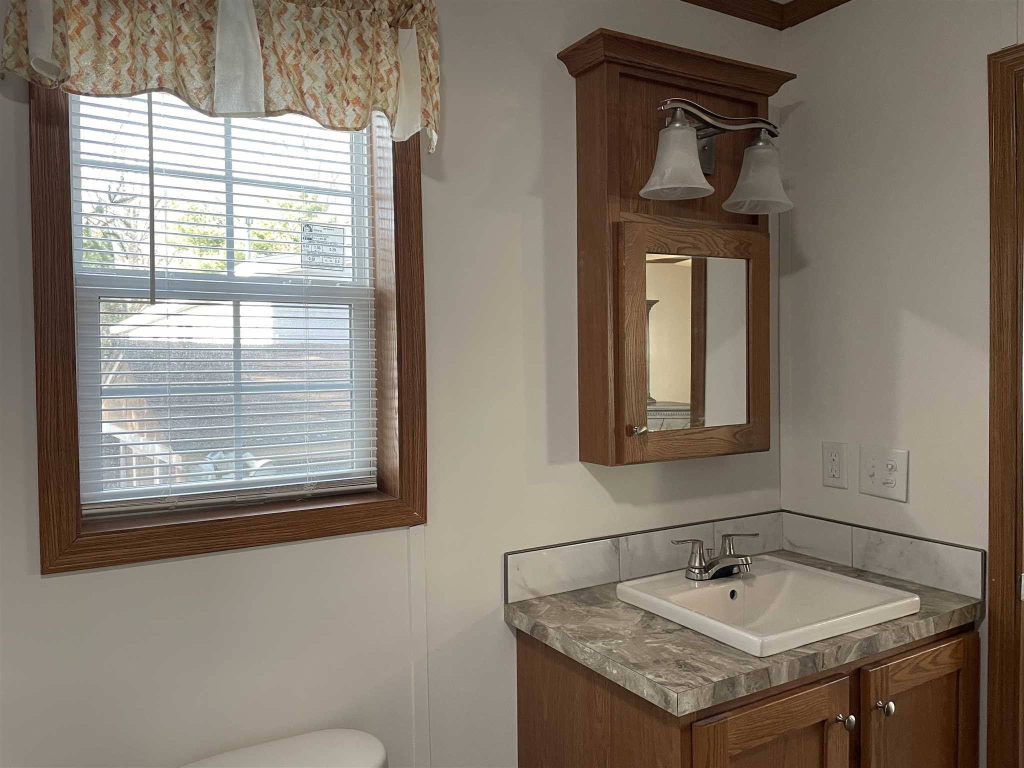 32 Scribo Lane Wappingers Falls, NY 12590 - Photo 13 of 16 a bathroom with a sink and a mirror
