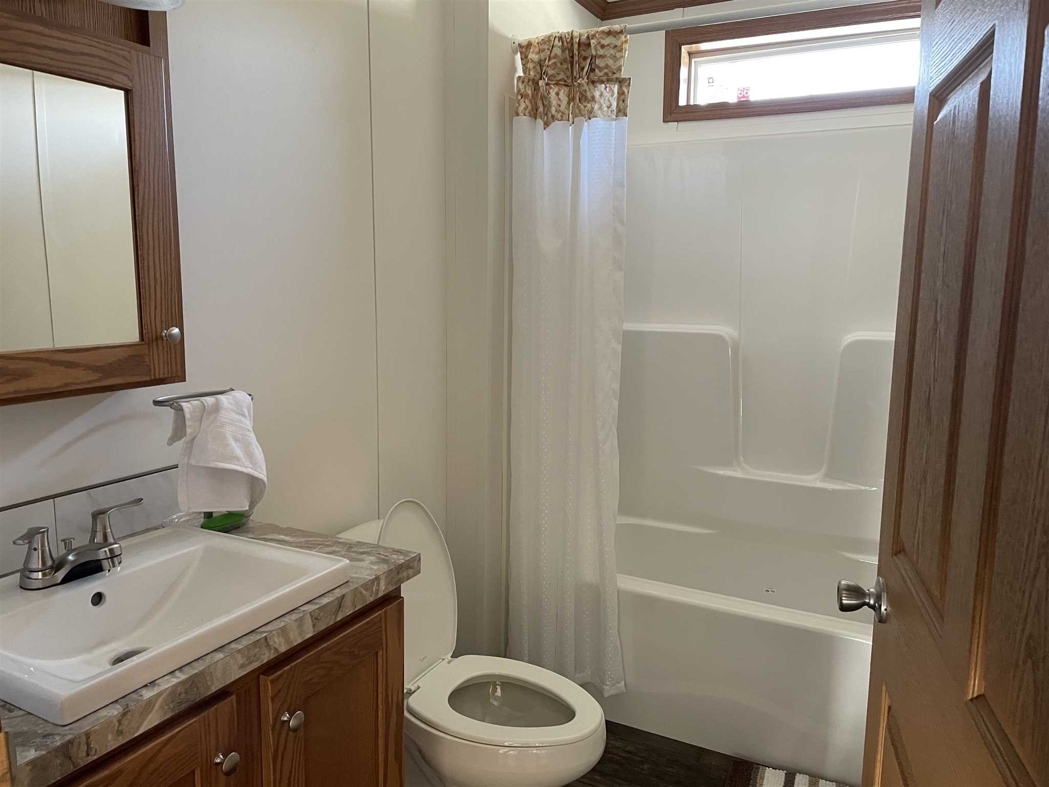 32 Scribo Lane Wappingers Falls, NY 12590 - Photo 14 of 16 a bathroom with a granite countertop toilet sink and mirror