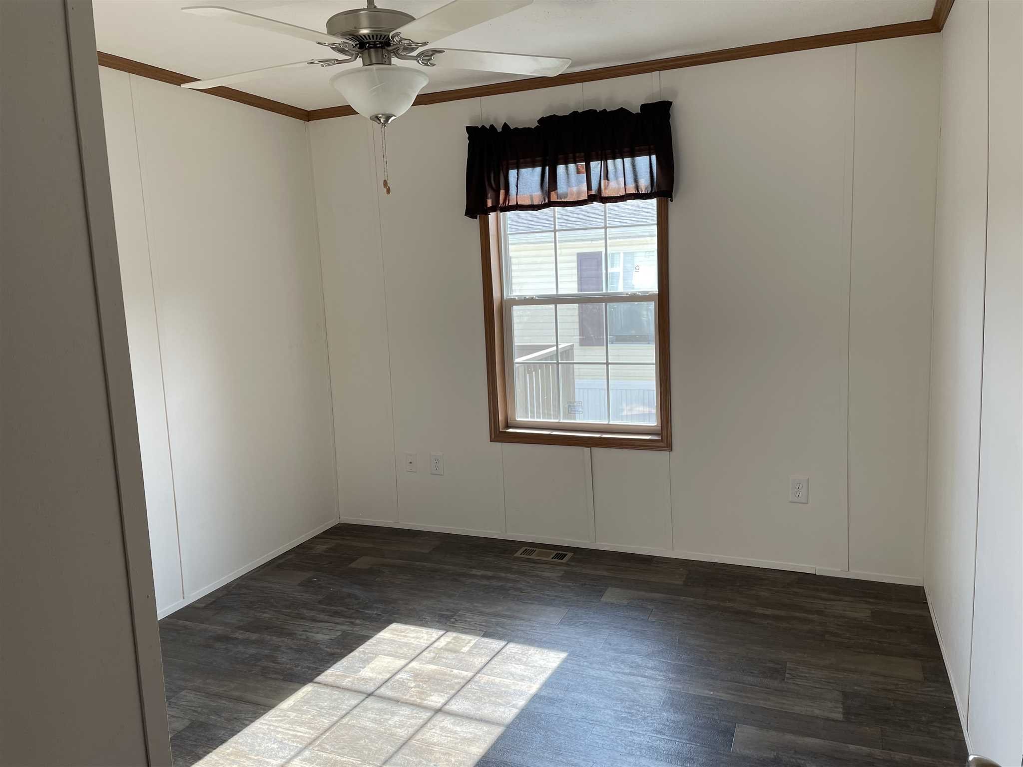 32 Scribo Lane Wappingers Falls, NY 12590 - Photo 16 of 16 an empty room with wooden floor fan and windows