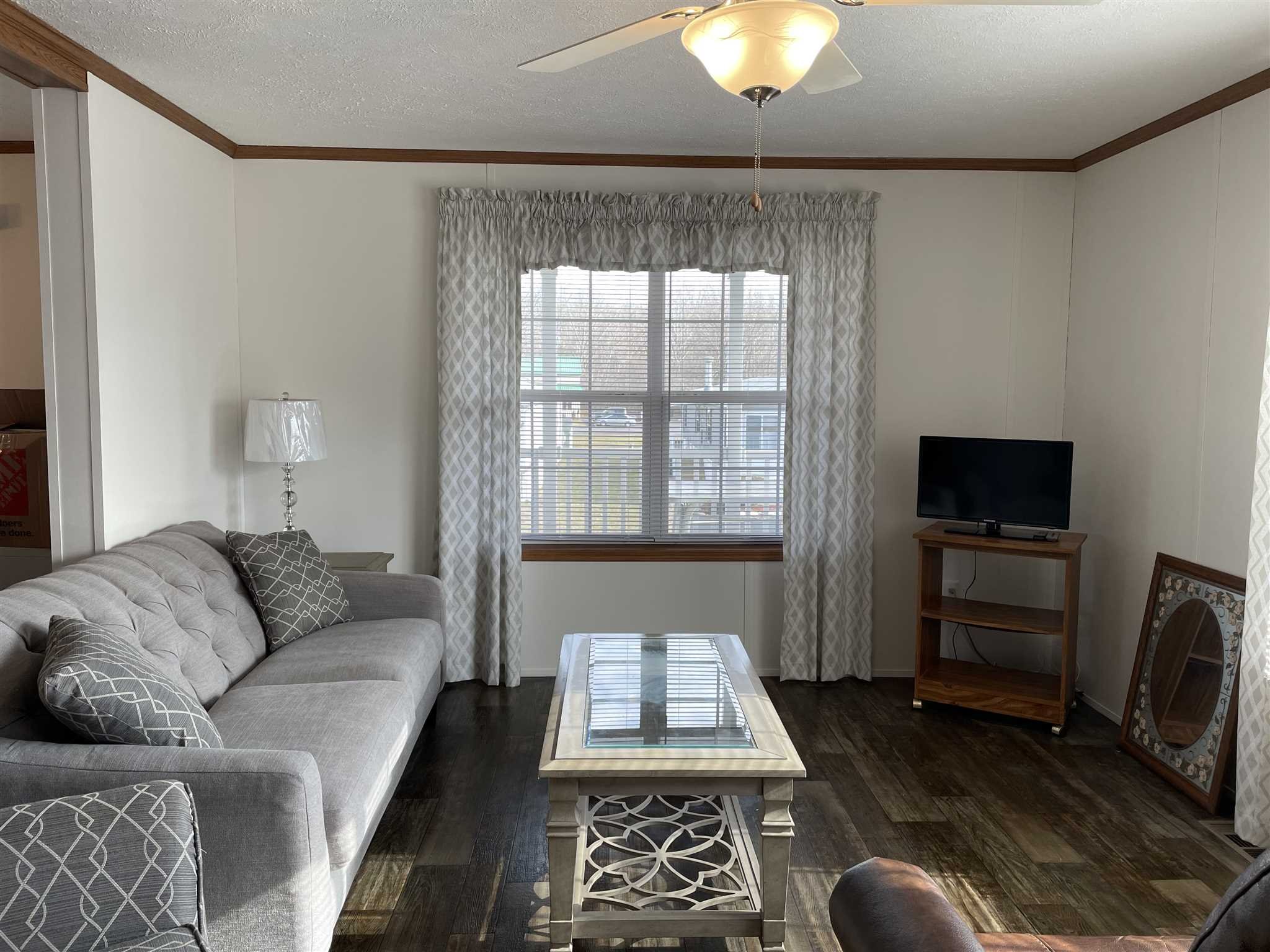 32 Scribo Lane Wappingers Falls, NY 12590 - Photo 9 of 16 a living room with furniture and a flat screen tv