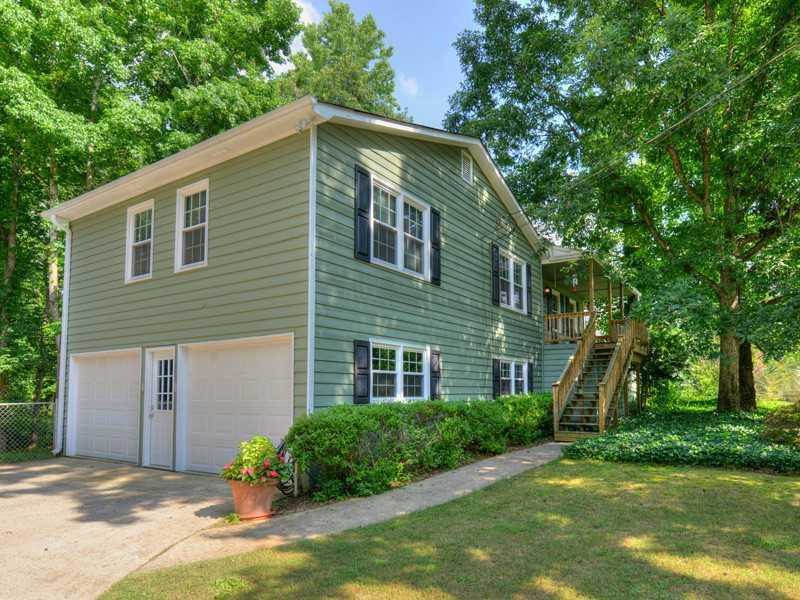 Exterior Front. Well maintained ranch style home features a rocking chair front porch with slate tile, new deck, all new insulated windows, freshly painted walls & trim & beautiful, wooded & fenced cul-de-sac lot  (.60 acre)!  FINISHED BASEMENT!  Great location!