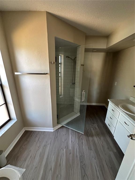 1423 Meadow Lark Road Spring Hill, FL 34606 - Photo 7 of 9 wooden floor in an empty room with a window