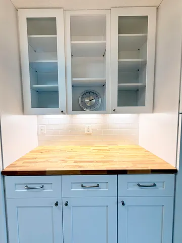 a view of window and cabinets