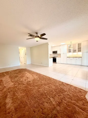 an empty room with a empty space and windows