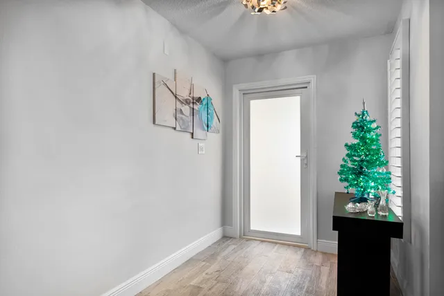 a living room with furniture and a book shelf