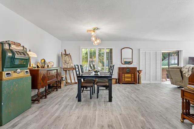 a view of a dining room with furniture window and wooden floor