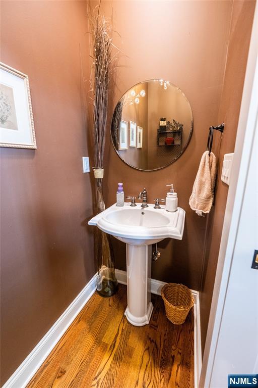 44 Forest Terrace Wayne, NJ 07470 - Photo 18 of 32 a bathroom with a sink toilet and mirror