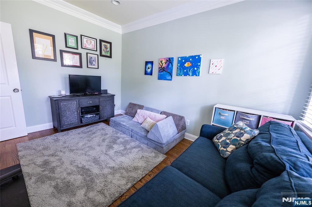44 Forest Terrace Wayne, NJ 07470 - Photo 19 of 32 a living room with furniture and a flat screen tv