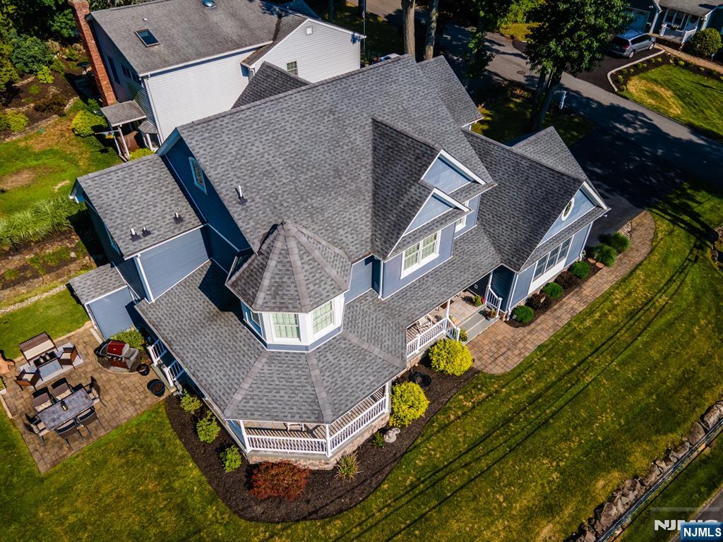 44 Forest Terrace Wayne, NJ 07470 - Photo 2 of 32 an aerial view of a house with a swimming pool and outdoor seating