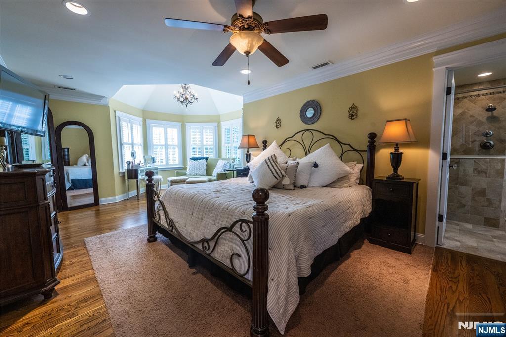 44 Forest Terrace Wayne, NJ 07470 - Photo 22 of 32 a bedroom with a bed ceiling fan and a large window