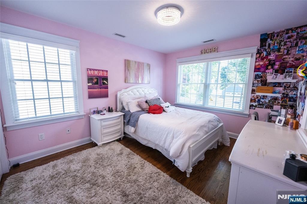 44 Forest Terrace Wayne, NJ 07470 - Photo 25 of 32 a bedroom with a bed and large windows