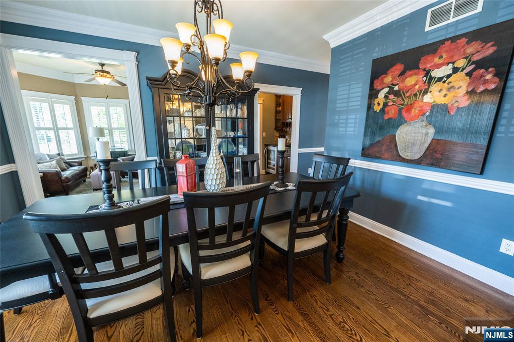 44 Forest Terrace Wayne, NJ 07470 - Photo 7 of 32 a view of a dining room with furniture wooden floor and chandelier