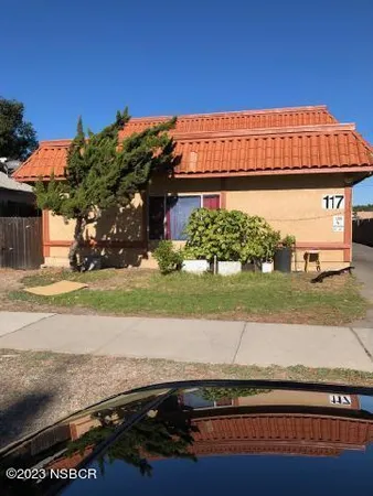 front view of a house with a street