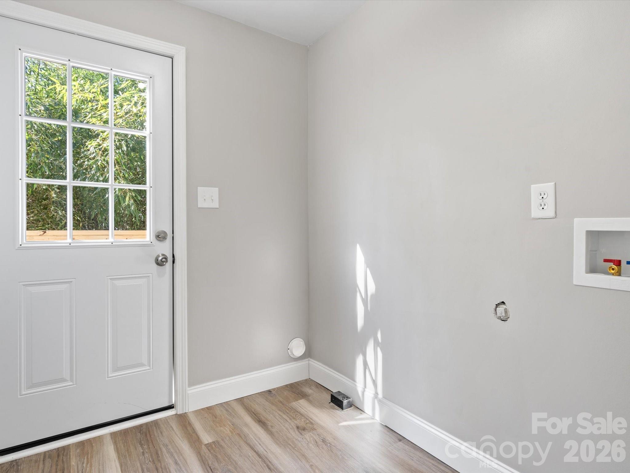 105 South York Street Lancaster, SC 29720 - Photo 17 of 28 a view of empty room with wooden floor and fan