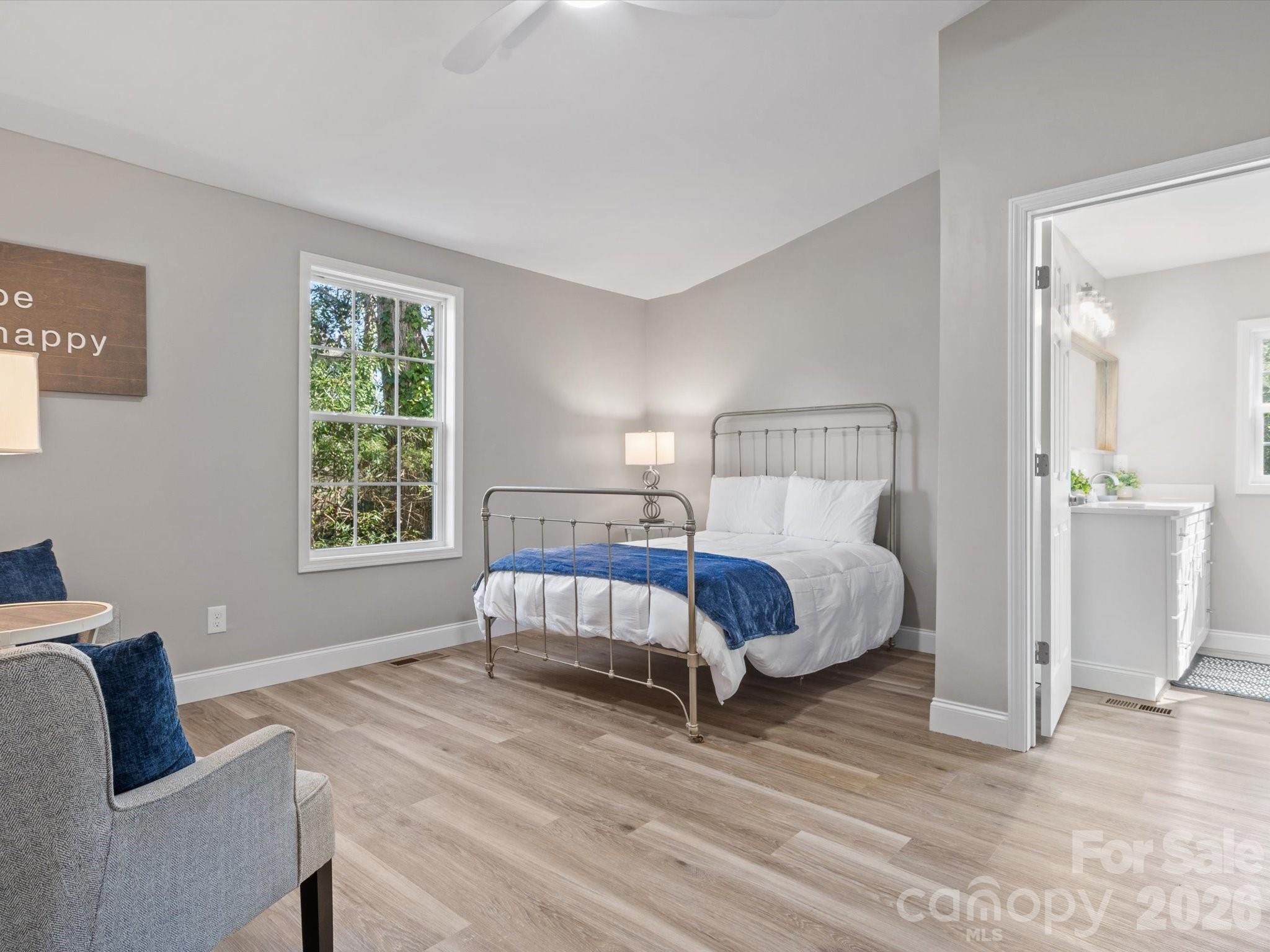 105 South York Street Lancaster, SC 29720 - Photo 18 of 28 a bed room with a bed and a couch