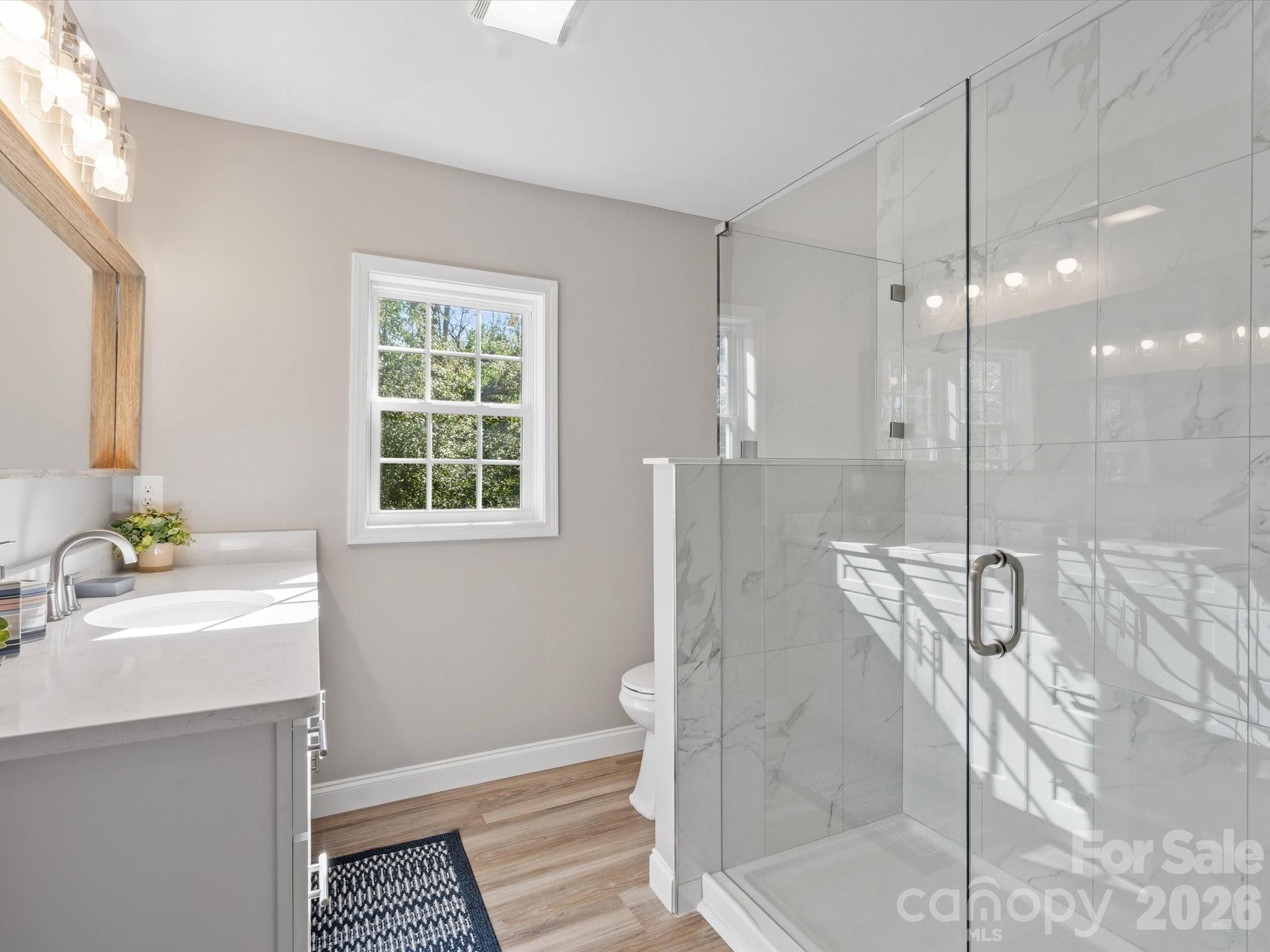 105 South York Street Lancaster, SC 29720 - Photo 20 of 28 a bathroom with a sink and a mirror