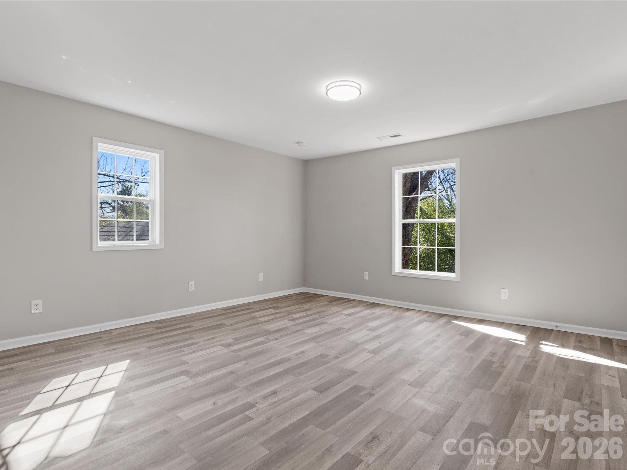 105 South York Street Lancaster, SC 29720 - Photo 25 of 28 a view of an empty room with wooden floor and a window