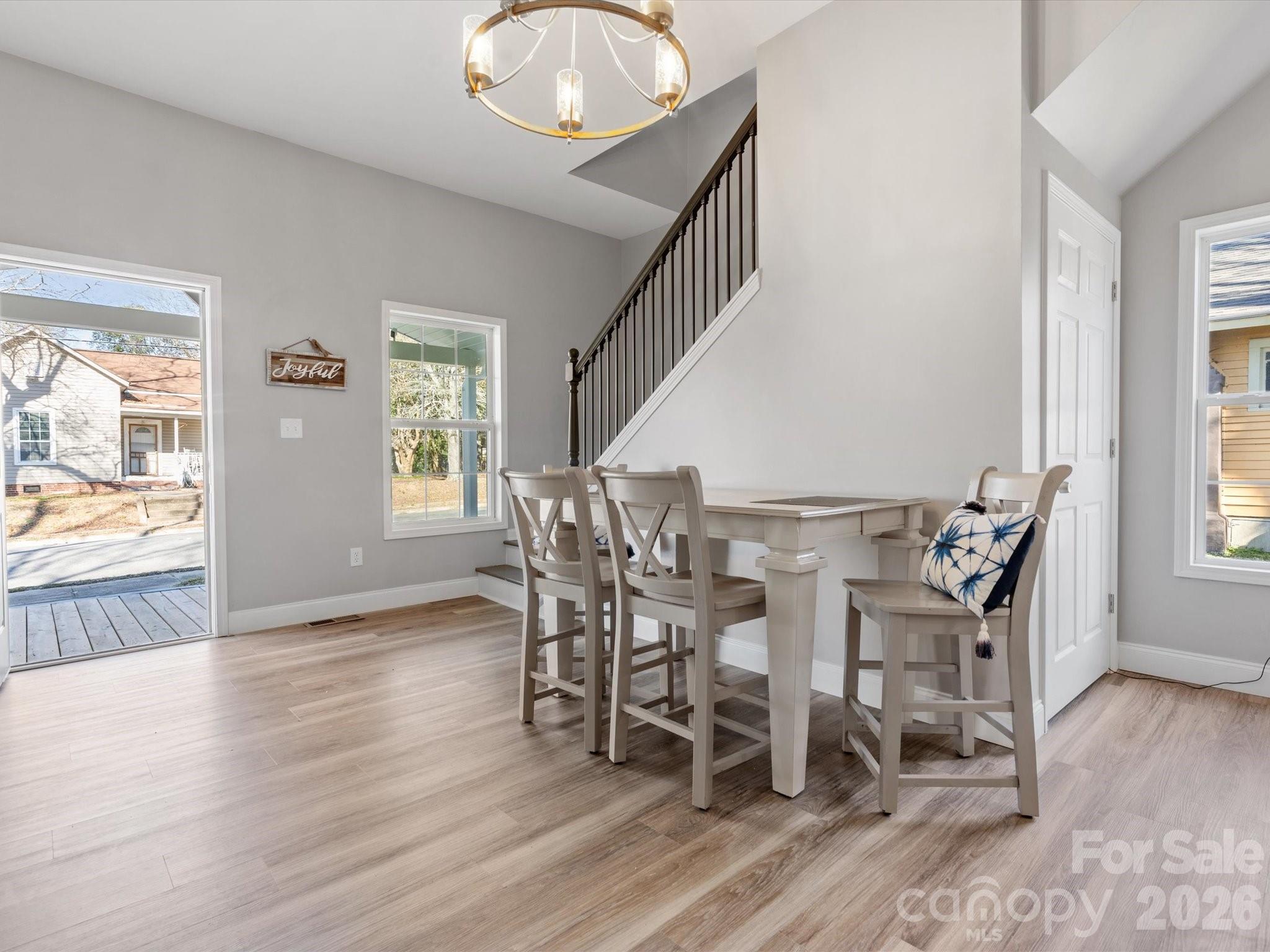 105 South York Street Lancaster, SC 29720 - Photo 3 of 28 a view of a dining room with furniture and wooden floor