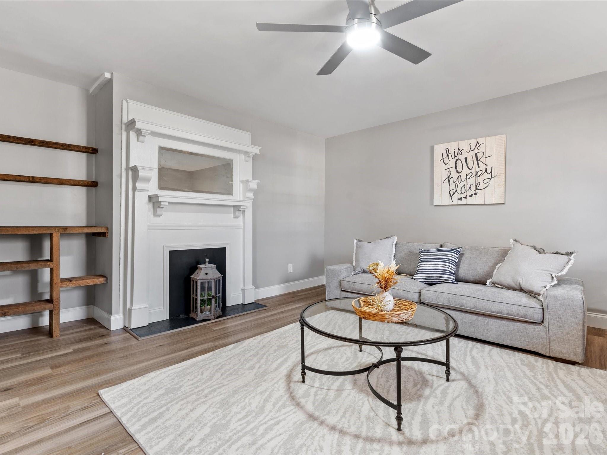 105 South York Street Lancaster, SC 29720 - Photo 6 of 28 a living room with furniture and a fireplace