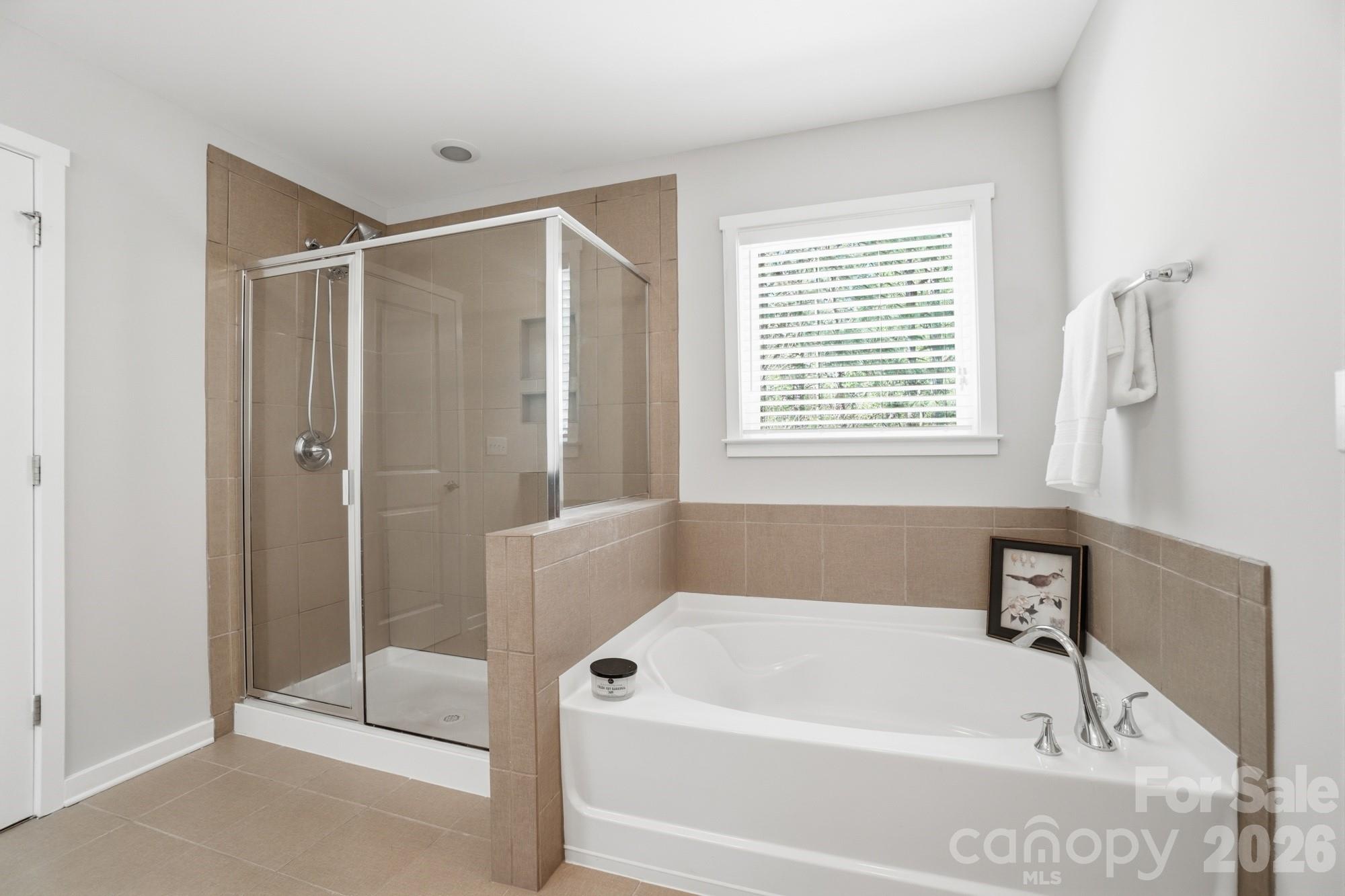2153 Bluebell Way Tega Cay, SC 29708 - Photo 32 of 48 a white bath tub sitting next to a window