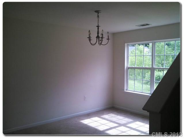 2216 Gooseberry Road Charlotte, NC 28208 - Photo 5 of 12 a view of empty room with windows