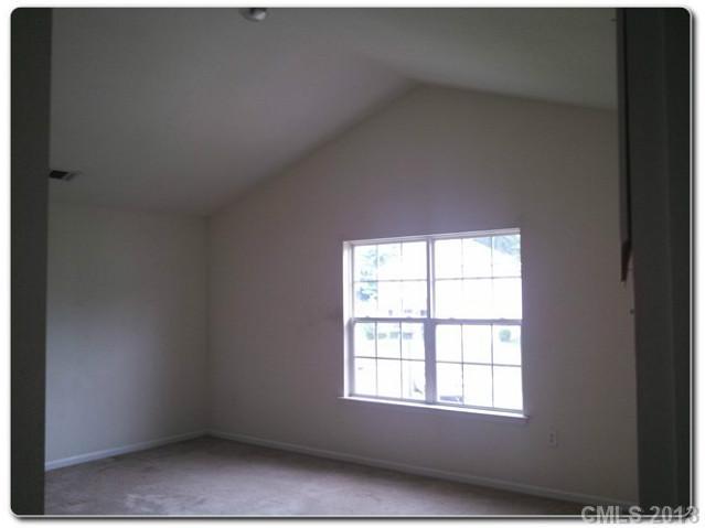 2216 Gooseberry Road Charlotte, NC 28208 - Photo 10 of 12 an empty room with a window