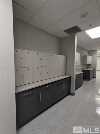 a view of an empty room with cabinet