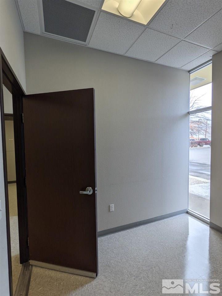 3745 North Carson Street, Unit 3745 Carson City, NV 89706 - Photo 24 of 33 an empty room with wooden floor and windows