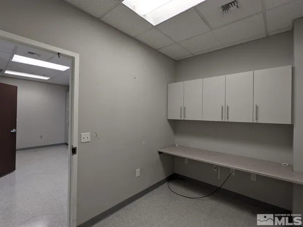 a room with a closet and cabinets